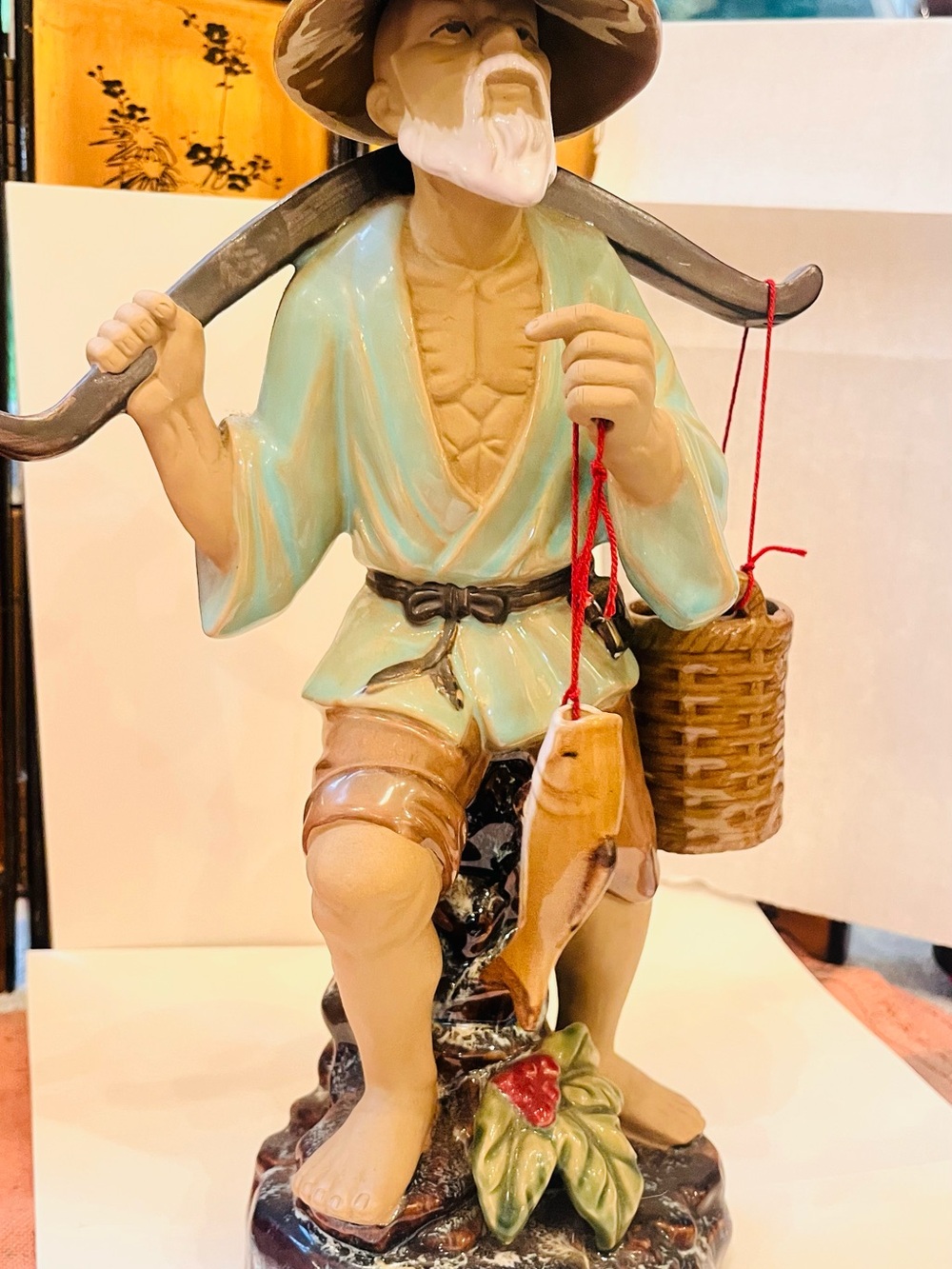 Hand-Painted Ceramic Fisherman Figurine in Light Blue and Tan